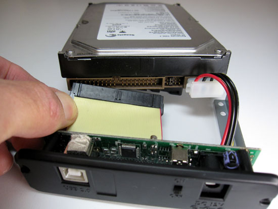 Connect the power and data cables to your portable hard drive enclosure's connectors.