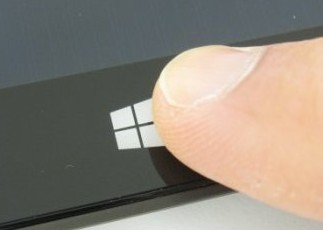 To take a screenshot in Windows RT, hold down the Windows key while simultaneously pressing the Volume Down rocker along the Surface RT's left side.